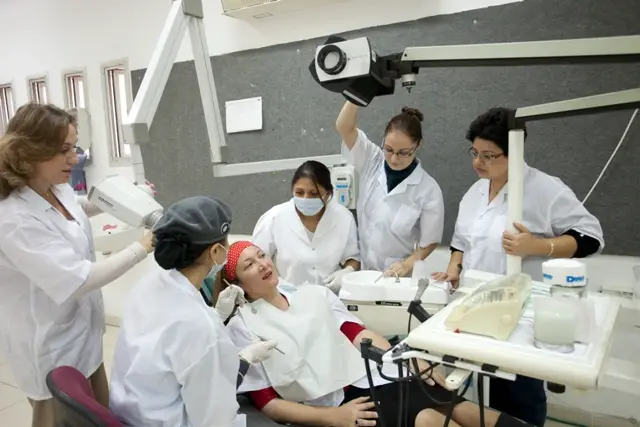orthodontist working with the assistant